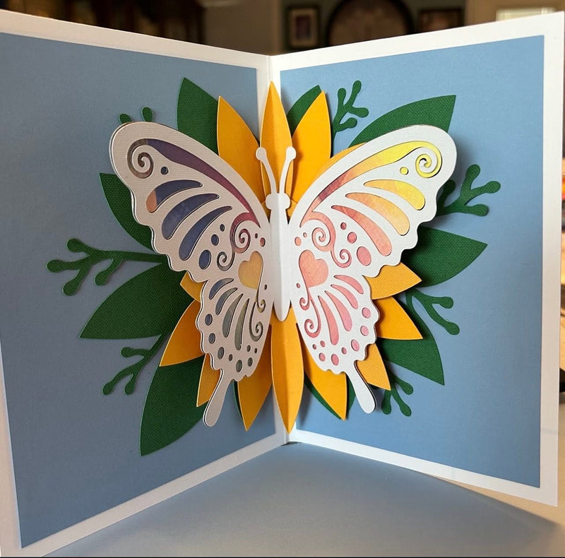 Handmade pop-up butterfly card with a paper sunflower and leaves, made by Kathy’s Card-tel