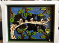 Handmade layered paper shadow box of three black bear cubs resting on a pine branch under a starry blue sky in a white frame